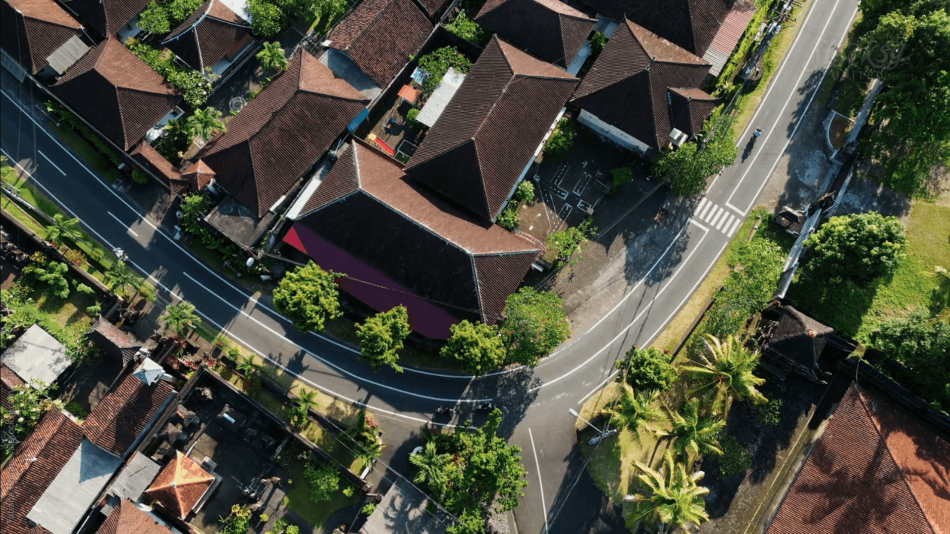 An aerial view of a tranquil, surburan neighborhood.